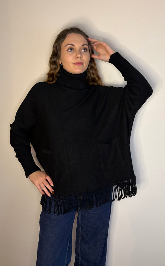 Pull col roulé à franges