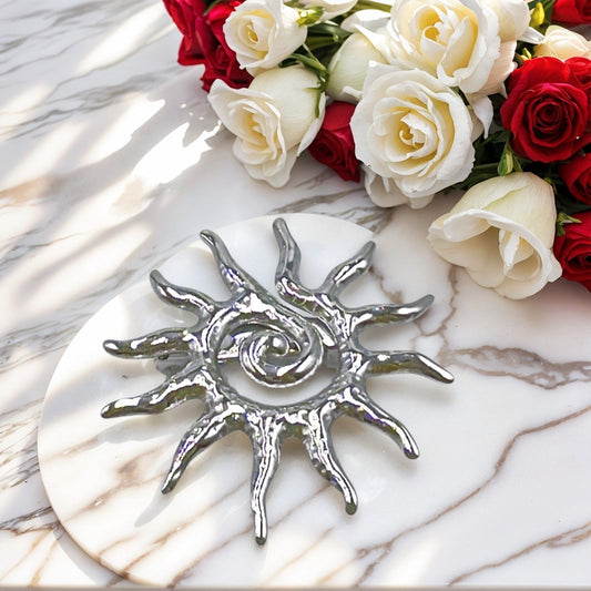Broche soleil argenté